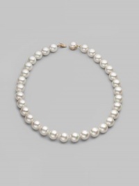 Elegant organic white man-made pearls make a perfect finishing touch. 14mm white round pearls Length, about 20 Mabé pearl and 18k gold vermeil push-lock clasp Made in Spain