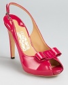 In the glossiest patent leather, these Salvatore Ferragamo pumps boast a juicy hue with playful style.