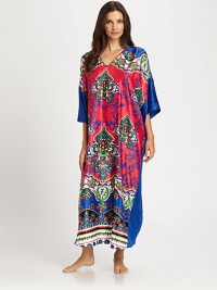 An artistic print defines this colorful design, rendered in signature lightweight fabric. V-neckWide dolman sleevesPullover styleAbout 52 from shoulder to hemPolyesterMachine washImported