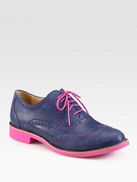 Candy-colored hues brighten this timeless leather oxford with wingtip details. Rubber heel, 1 (25mm)Leather upperLeather liningRubber solePadded insoleImported