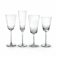 Kate Spade and Lenox join together to bring ease, elegance and understated wit to the table. Larabee Dot Stemware features etched polka dots and coordinate with the Larabee Dot Accent Plates. Shown from left to right: goblet, flute, iced beverage, wine glass.