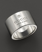 From the Gucci Trademark collection, a sterling silver ring adorned with Gucci logo and etched stripe pattern. Designed by Gucci.