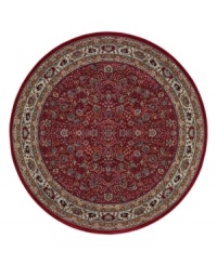 A larger-diameter round ideal for great rooms and other open spaces. Inspired by the lovely Sarouk carpets of ancient Persia, this rug features an intricate floral motif in ivory, sage green and accents of soft blue against a rich red ground.