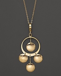 Hammered 14K yellow gold discs dance and dangle from a slim hoop.