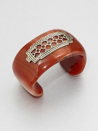 From the Dot Collection. This nature-inspired style from a socially and environmentally responsible brand features a stunning red agate cuff decorated with a delicate, sterling silver cutout center surrounded by a dotted 18k gold border. Red agateSterling silver18k goldDiameter, about 2.3Slip-on styleImported