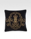 An embroidered skull-and-crossbones motif lends a stylish sense of danger to a plush velvet pillow for a relaxed yet refined aesthetic.22 squareMetal bullion embroideryCotton velvetDry cleanImported