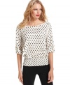 MICHAEL Michael Kors' polka-dot blouse has chic roll-tab sleeves and a smocked waist for a superlative fit.