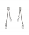 Complement your evening wear with pristine drops by Swarovski. Double faceted crystal drops are suspended from crystal-coated rectangular posts. Crafted in silver tone mixed metal. Approximate drop: 2-5/16 inches.