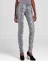 Statement snakeskin print takes these MICHAEL Michael Kors skinny jeans for a walk on the wild side. Amp up the fierce factor with sleek booties.