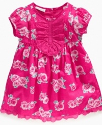 Give her a rosy disposition with this lovely eyelet-detailed dress from First Impressions.