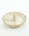 A single rose blossom and delicate dots carved in ivory porcelain make this classic ring holder a fine storage space for special jewelry. With a scalloped, gold-tipped rim.