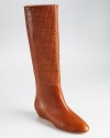 Waving weaves lend textural appeal to Loeffler Randall's Matilde boots, a tall, streamlined silhouette with a subtle wedge heel.