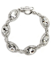 You've thought of every last detail, now for the finishing touches. The glamorous oval shape and subtly shimmering glass design of Givenchy's bridal bracelet make it the perfect piece for your special day. Crafted in silver-plated mixed metal. Approximate length: 7-1/4 inches.