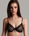 A delicate and sheer shadow striped lace underwire bra with bow detail at front. Contrasting lace trim and adjustable straps. Hook and eye closure.