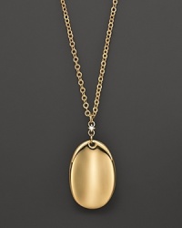 A gleaming oval of 18K yellow gold adds luxe to your look. By Roberto Coin.