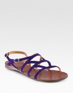 Strappy suede essential with a rubber sole and an adjustable ankle strap. Suede upperLeather liningRubber solePadded insoleMade in SpainOUR FIT MODEL RECOMMENDS ordering one half size up as this style runs small. 