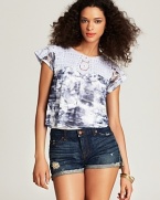 A Free People tie-dye tee decorated with crochet lace at the yoke and shoulders is a playful addition to summer--perfect when paired with cut-off denim or worn over an itty-bitty bikini.