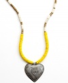 A strong heart. Strung with wooden beads and a hand-cut and hammered pendant, this Heart of Haiti necklace is crafted by a co-op that supports women's employment in local communities.