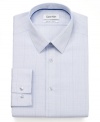 A classic checkered pattern gets a modern upgrade with this slim-fit, no-iron dress shirt from Calvin Klein.