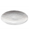 Handcrafted in aluminum alloy with an organic shape and brushed finish, the round Dimension tray from Donna Karan Lenox lends a serene, dreamy quality to modern tables.