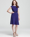 A swing skirt lends a ladylike look to this belted Anne Klein dress.