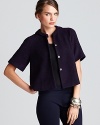 Swing into the season with a boxy T Tahari cape touting a generous back pleat for serious fashion presence.