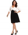 A twisted front beautifully finishes Spense's three-quarter sleeve plus size dress, defined by a slenderizing A-line shape-- wear it from desk to dinner!