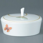 For over two centuries Raynaud has created unique Limoges porcelain, with a marked preference for relief shapes and generously colored and gilt decorations. Metamorphoses is a striking pattern of red and gold with a butterfly motif.