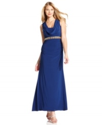 Xscape's evening gown is elevated by a dramatic cowl neckline at the front and back and a beautiful beaded empire waist.