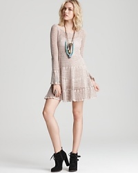 A soft cotton Free People dress pleases with boho bell sleeves and a femme flared skirt--hippie-chic with textured booties and beaded necklaces.