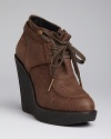 Wedge booties and menswear-inspired oxford details are both musts this year; have it all in this high-style Burberry pair.