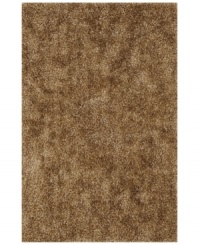 Add rich, shimmering texture to any modern room with the Metallic taupe area rug from Dalyn. Hand-tufted of soft polyester, this high-luster shag area rug puts comfort and fun back in floor decor.