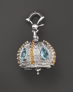 Inspired by Zen philosophy, this polished sterling silver Raja meditation bell from Paul Morelli is set with blue topaz and yellow citrine.