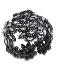 Fashion that goes off like a big bang. This stretch bracelet lends a gorgeous touch to your outfits with plastic stone accents in a starburst design. Stretches to fit wrist. Crafted in hematite tone mixed metal. Approximate diameter: 2-1/2 inches.