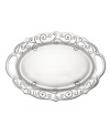 With a feminine edge and pretty perforated detail, the large French Perle handled tray from Lenox's collection of serveware and serving dishes holds roast turkey, grilled fish, or a pile of BLTs with decidedly vintage charm. In pure aluminum, it's a brilliant complement to French Perle dinnerware. (Clearance)