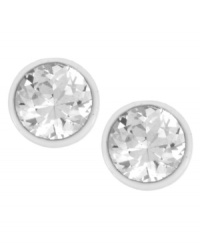 Crisp color for the season, by Kenneth Cole New York. These white tone stud earrings boasts sparkling, round-cut crystal accents in a cup setting. Crafted in gold tone mixed metal. Approximate diameter: 1/2 inch.