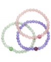 Solo standouts, but lovely layered too. This trio of stretch bracelets adds a playful touch to any look. Each bracelet is composed of jade rose quartz and crystal beads (6 mm) in mint green, lavender and light pink hues. Approximate length: 7 inches.