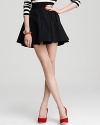 Playful pleats and essential pockets lend go-everywhere flair to this Juicy Couture skirt.