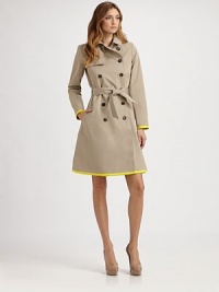 This classic trench style is trimmed with vibrant piping in an on-trend hue.Foldover collarGunflapDouble-breasted button frontSelf beltSide slash pocketsContrast trimBack rainflapFully linedAbout 37 from shoulder to hem82% cotton/18% silkDry cleanMade in France of imported fabricModel shown is 5'11 (180cm) wearing US size 4. 