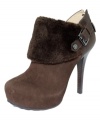 Cuffed and cute. GUESS's Oleta faux fur booties make a statement with a side buckle and zip up back.