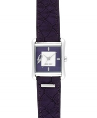 Exotic textures and bold color combine for the perfect everyday watch, by Nine West. Crafted of purple textured leather strap and square silver tone mixed metal case. Purple dial with white inner dial features silver tone applied stick indices, numeral at nine o'clock, silver tone hour and minute hands, sweeping second hand and logo at six o'clock. Quartz movement. Limited lifetime warranty.