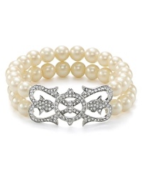 This Carolee bracelet is a jewel box style to wear now and treasure forever, crafted of two rows of glassy pearls with an ornate crystal accent.