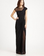 This elegant gown is rendered in fluid drape jersey and accented with a sheer illusion neckline panel.Jewel necklineCap sleevesIllusion asymmetrical necklineRuched bodiceDraped skirtConcealed back zipFully linedAbout 53 from natural waist93% nylon/7% spandexDry cleanImportedModel shown is 5'11 (180cm) wearing US size Small.OUR FIT MODEL RECOMMENDS ordering true size. 