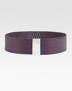 A supple leather design detailed in chic perforations and a logo engraved, metal buckle. Width, about 2¼Imported 