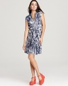 A global-inspired Ikat print emboldens this Velvet by Graham & Spencer dress, complete with a waist-cinching tie.