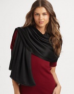 Hand-woven and hand-dyed cashmere/silk wrap reverses from a matte to a shine. Woven satin ball fringe 78L X 22W Imported