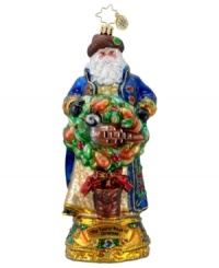 This Twelve Days of Christmas ornament from Christopher Radko features jolly St. Nick with rosy cheeks, long white beard and a dusting of sparkling glitter as he holds the first gift from the classic Christmas song, a partridge in a pear tree.