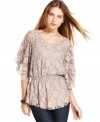 Floral lace and flutter sleeves are just two of the reasons Style&co.'s smocked lace top looks extra feminine.