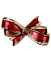 Put a bow on your new look. This festive box pin from Jones New York is styled in an bow design and is embellished with shimmering plastic stones. Crafted in gold tone mixed metal. Approximate length: 2 inches. Approximate width: 1-1/4 inches. Includes gift box.