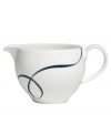 Vera Wang combines her passions for skating and design in the everyday fine Glisse creamer. An indigo-blue ribbon follows the path of a twirling figure skater, sweeping across smooth, snow-white bone china with modern grace.